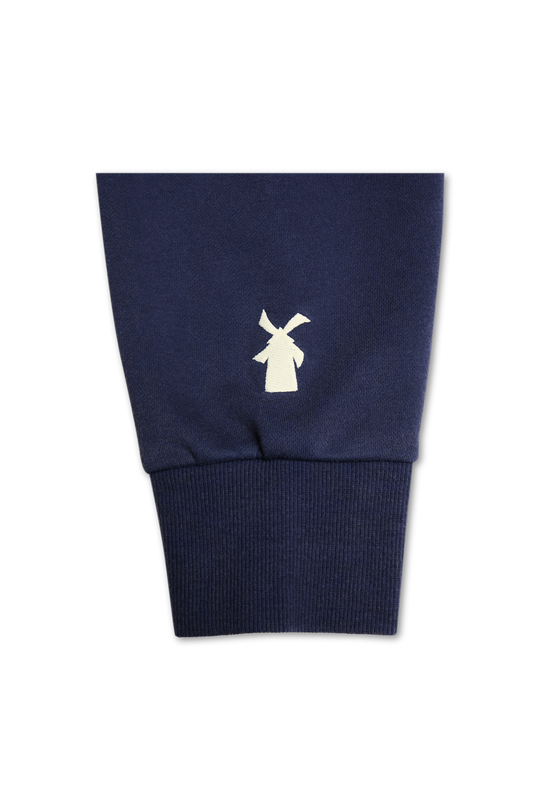 Navy blue sweater with a white logo on a white background