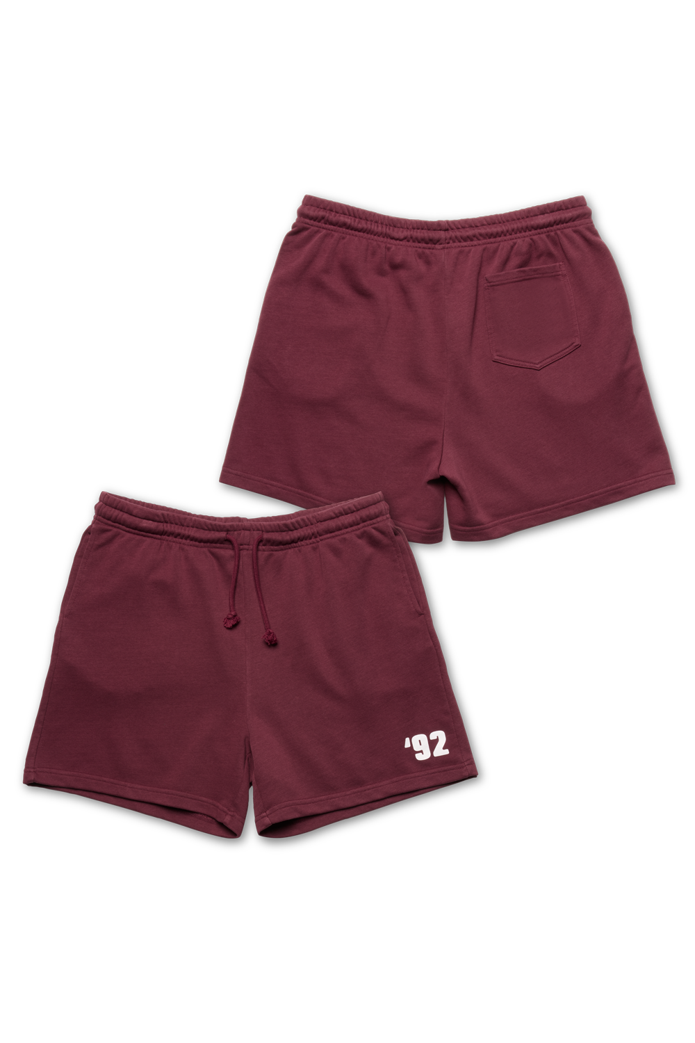 Two pairs of maroon shorts on a white background