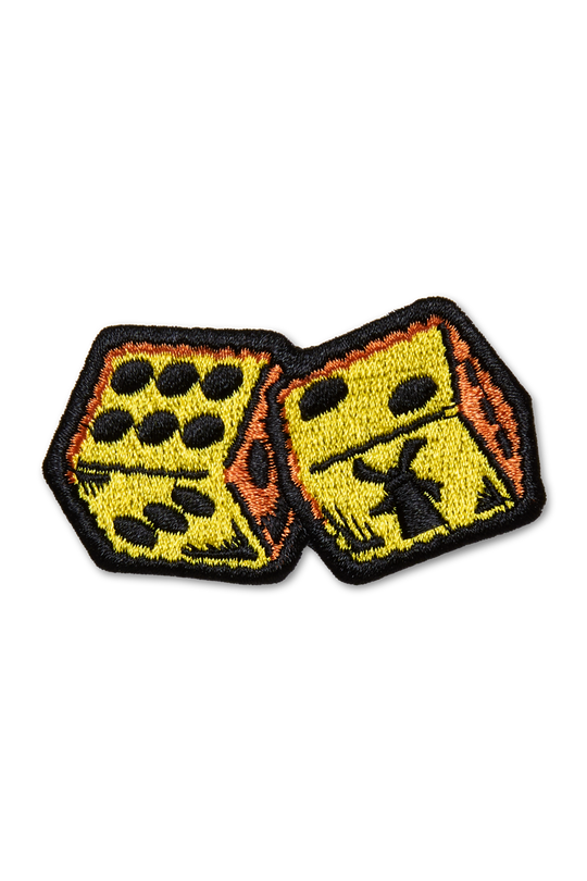 Embroidered patch of two dice with black dots on a white background