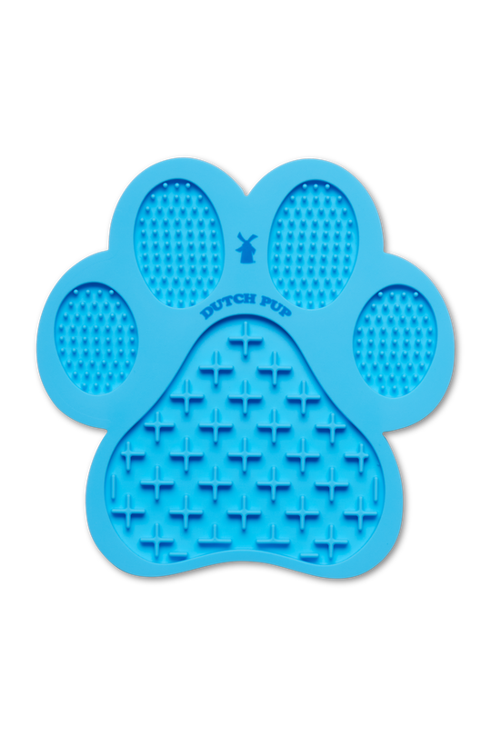 A blue paw-shaped silicone lick mat or chew toy with textured grooves and the words 'DUTCH PUP' printed in the center, shown on a plain white background.