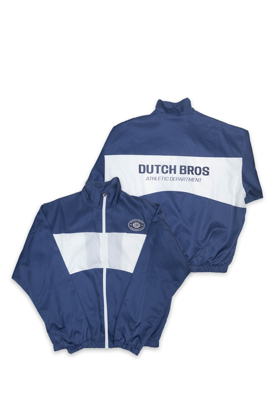 Two navy blue windbreaker jackets with white color-blocked panels, one showing the front and the other the back with 'DUTCH BROS ATHLETIC DEPARTMENT' printed in blue. A small circular logo is visible on the front chest