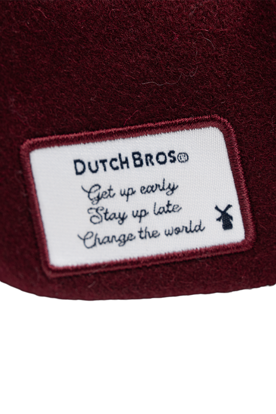 Dutch Bros logo on a maroon background