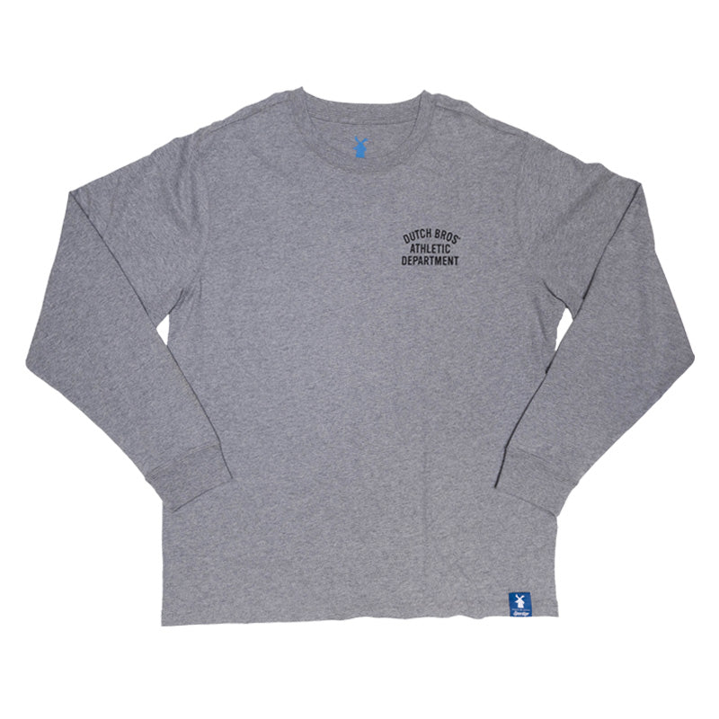 A heather gray long-sleeve t-shirt with a black arched graphic on the left chest reading 'DUTCH BROS ATHLETIC DEPARTMENT'. The shirt is laid flat against a solid white background, featuring a small blue tag near the bottom right hem.