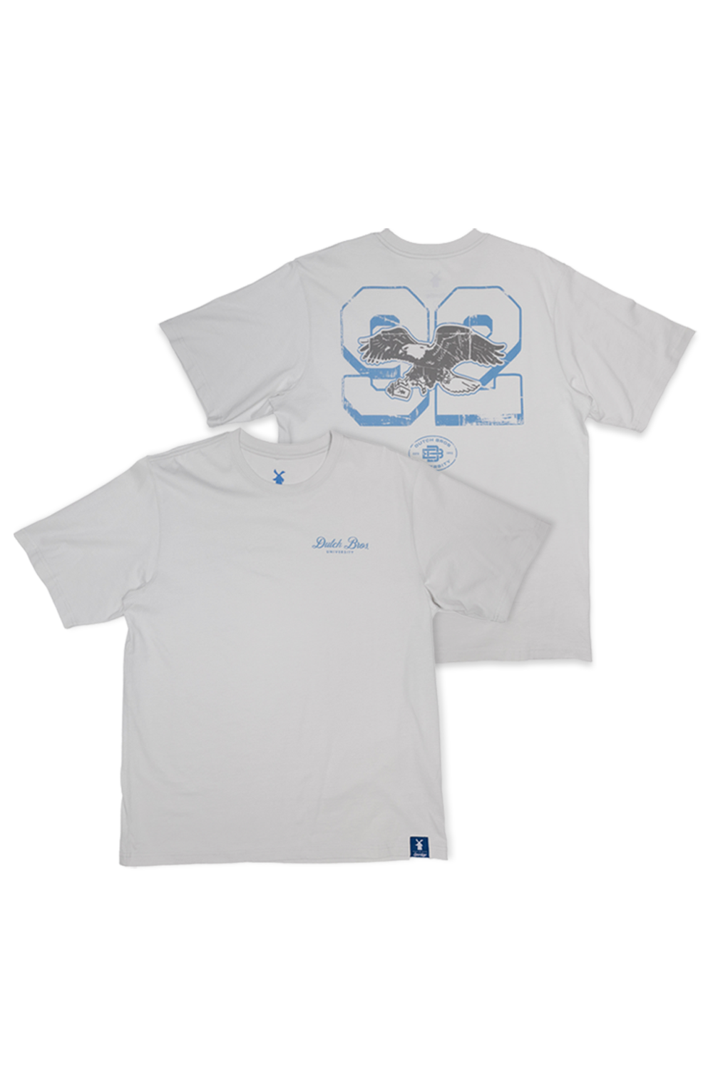 Two light gray t-shirts shown against a white background, displaying the front and back views. The front shirt features a small blue script logo saying Dutch Bros on the left chest and on the back 92 with an eagle logo.