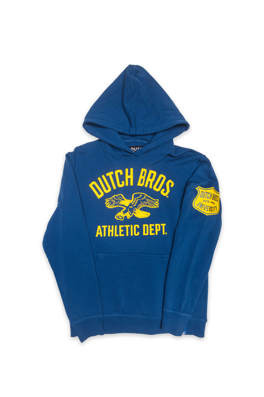flatlay of blue dutch bros hoodie with dutch bros athletic dept and eagle graphic with shield patch on the sleeve